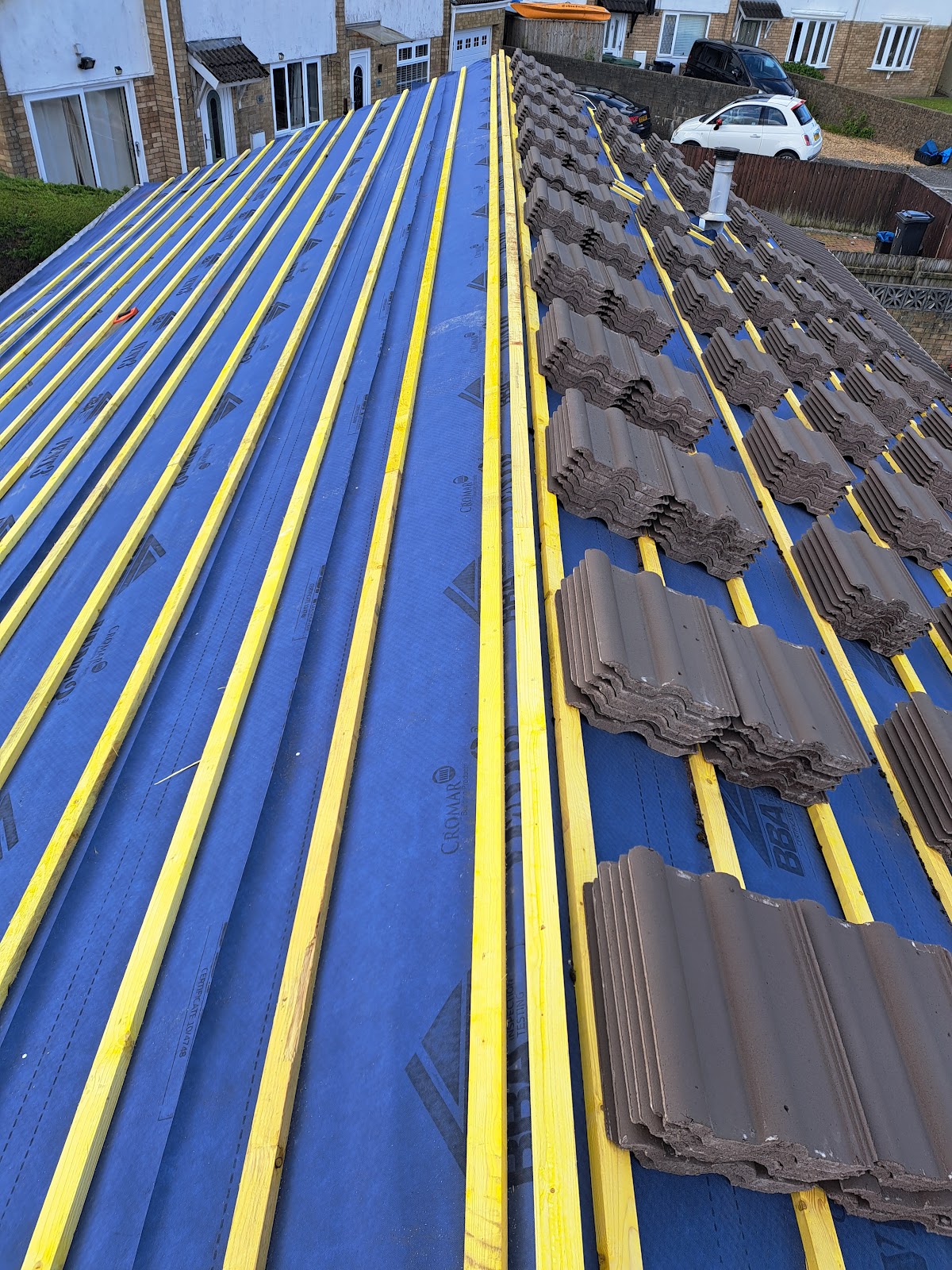 Re-roof in progress with breathable membrane, battens and new tiles