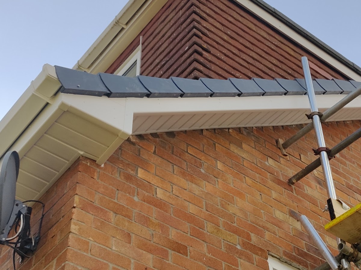 New grey dry-ridge and cream uPVC fascias, soffits and guttering